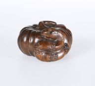 A JAPANESE CARVED WOODEN NETSUKE