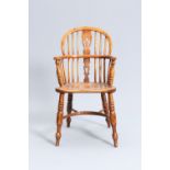 AN EARLY 19TH CENTURY ELM AND OAK CHILD'S WINDSOR CHAIR