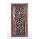 A CARVED OAK PANEL DECORATED IN RELIEF WITH GOTHIC TRACERY