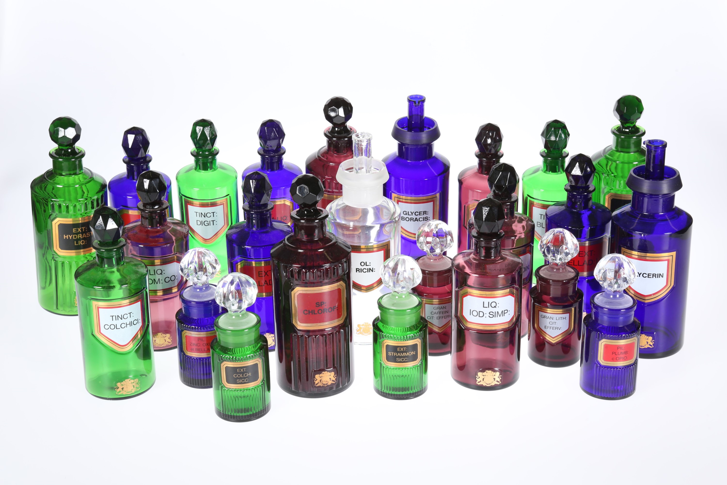 A LARGE COLLECTION OF COLOURED AND CLEAR GLASS PERIOD STYLE PHARMACEUTICAL JARS AND AND MEASURES