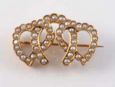 A LATE 19TH CENTURY SEED PEARL SET BROOCH