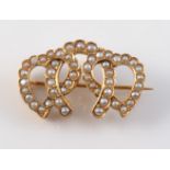 A LATE 19TH CENTURY SEED PEARL SET BROOCH