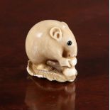 A JAPANESE IVORY NETSUKE OF A MOUSE