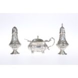 AN EDWARDIAN SILVER THREE PIECE CONDIMENT SET, WILLIAM HUTTON & SONS, BIRMINGHAM 1904,