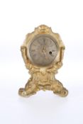 A SMALL GILT-METAL CLOCK WITH VERGE WATCH MOVEMENT