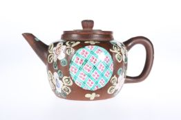 AN INTERESTING CHINESE POLYCHROME ENAMELLED YIXING TEAPOT