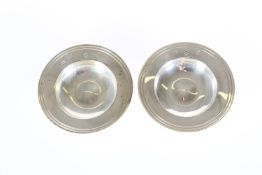 A PAIR OF SMALL SILVER ALMS DISHES