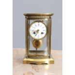 A LATE 19th CENTURY FRENCH BRASS FOUR-GLASS MANTEL CLOCK