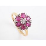 AN 18CT YELLOW GOLD RUBY AND DIAMOND CLUSTER RING