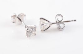 A PAIR OF 18CT WHITE GOLD AND DIAMOND EAR STUDS
