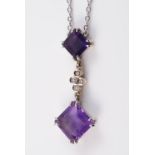 AN AMETHYST SET PENDANT