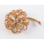 AN 18CT YELLOW GOLD AND DIAMOND BROOCH BY VOURAKIS