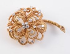 AN 18CT YELLOW GOLD AND DIAMOND BROOCH BY VOURAKIS
