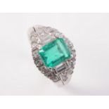 AN 18CT WHITE GOLD, COLOMBIAN EMERALD AND DIAMOND RING