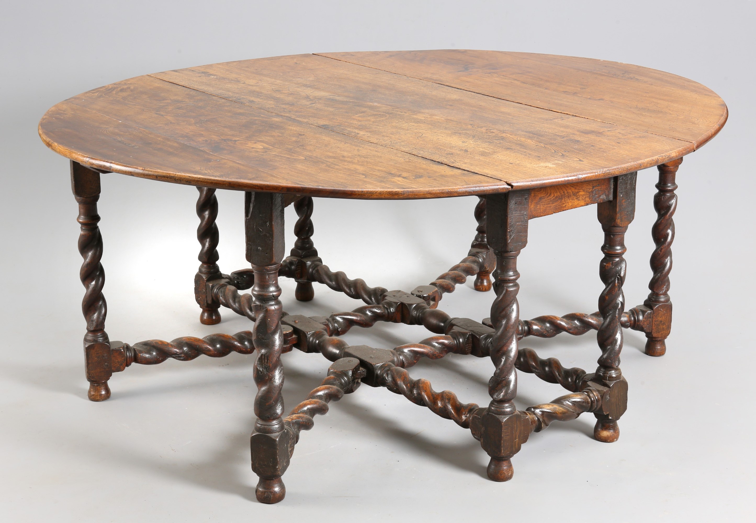 A LARGE CHARLES II JOINED OAK GATELEG DINING TABLE, CIRCA 1680 AND LATER