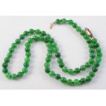 A JADEITE BEAD NECKLACE