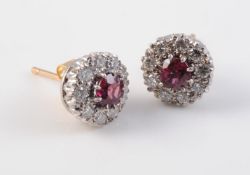 A PAIR OF RUBY AND DIAMOND CLUSTER EARRINGS
