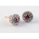 A PAIR OF RUBY AND DIAMOND CLUSTER EARRINGS