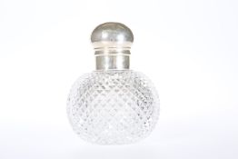 A LARGE SILVER-TOPPED (UNMARKED) CUT-GLASS SCENT BOTTLE, c. 1900