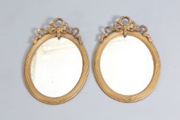 A PAIR OF 19TH CENTURY GILT GESSO OVAL MIRRORS