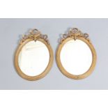 A PAIR OF 19TH CENTURY GILT GESSO OVAL MIRRORS