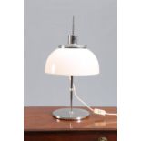 A HARVEY GUZZINI ADJUSTABLE TABLE LAMP, CIRCA 1960