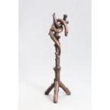 A CARVED OAK "SERPENT" HAT AND COAT STAND