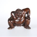 A JAPANESE CARVED WOODEN NETSUKE