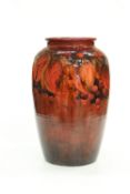 WILLIAM MOORCROFT, A VERY LARGE AUTUMN LEAVES AND BERRIES FLAMBE VASE, OF EXHIBITION QUALITY