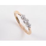 AN 18CT YELLOW GOLD AND DIAMOND RING