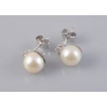 A PAIR OF CULTURED PEARL AND DIAMOND EAR STUDS