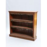 A VICTORIAN OAK OPEN BOOKCASE