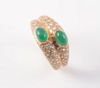 A DIAMOND AND EMERALD RING BY CARTIER