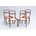 A SET OF FOUR REGENCY MAHOGANY AND CANEWORK DINING CHAIRS