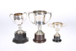 A GROUP OF THREE SILVER TROPHIES