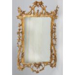 A ROCOCO REVIVAL CARVED AND GILT GESSO MIRROR