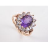 A 9CT YELLOW GOLD, AMETHYST AND DIAMOND RING
