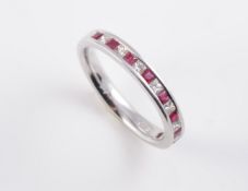 AN 18CT WHITE GOLD, RUBY AND DIAMOND RING