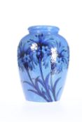 WILLIAM MOORCROFT, A CORNFLOWER PATTERN POWDER BLUE VASE, CIRCA 1925