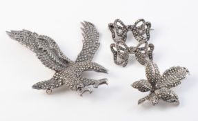 FOUR SILVER AND MARCASITE SET BROOCHES