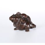 A JAPANESE WOODEN NETSUKE