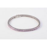 AN 18CT WHITE GOLD AND PINK ZIRCON LINE BRACELET