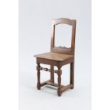 AN 18TH CENTURY OAK CHILD'S CHAIR