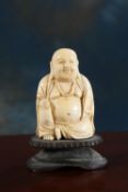 A 19TH CENTURY CHINESE CARVED IVORY BUDDHA