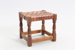A YORKSHIRE OAK AND LEATHER TOPPED STOOL