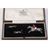 A LATE 19TH CENTURY HUNTSMAN, HOUND AND FOX BROOCH