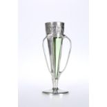 A LIBERTY & CO ENGLISH PEWTER AND GREEN GLASS VASE, DESIGNED BY ARCHIBALD KNOX
