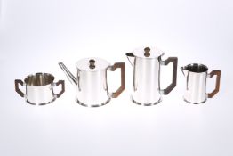 A VINTAGE ENGLISH WHITE METAL FOUR PIECE TEA AND COFFEE SERVICE IN THE ART DECO TASTE