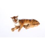 A RARE ROYAL DOULTON MODEL OF A LYING TIGER