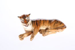 A RARE ROYAL DOULTON MODEL OF A LYING TIGER